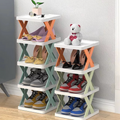Two four-tier shoe storage racks with white shelves and colorful X-shaped side supports, shown holding various shoes and small decorative items in a room setting.